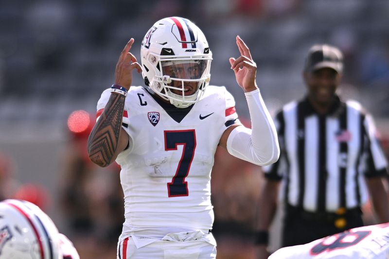 Sep 3, 2022; San Diego, California, USA; Arizona Wildcats quarterback Jayden de Laura (7) gestures at the line of scrimmage during the second half against the San Diego State Aztecs at Snapdragon Stadium. Mandatory Credit: Orlando Ramirez-USA TODAY Sports