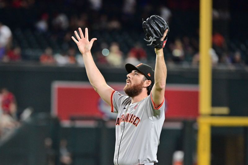 Sep 23, 2024; Phoenix, Arizona, USA;  San Francisco Giants pitcher Ryan Walker (74) celebrates after defeating the Arizona Diamondbacks at Chase Field. Mandatory Credit: Matt Kartozian-Imagn Images