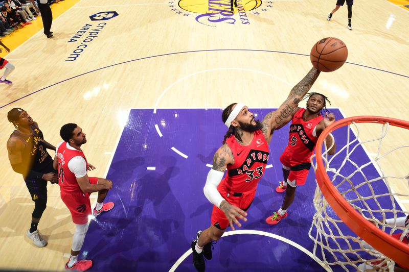 LOS ANGELES, CA - JANUARY 9: Gary Trent Jr. #33 of the Toronto Raptors rebounds the ball during the game against the Los Angeles Lakers on January 9, 2024 at Crypto.Com Arena in Los Angeles, California. NOTE TO USER: User expressly acknowledges and agrees that, by downloading and/or using this Photograph, user is consenting to the terms and conditions of the Getty Images License Agreement. Mandatory Copyright Notice: Copyright 2024 NBAE (Photo by Adam Pantozzi/NBAE via Getty Images)