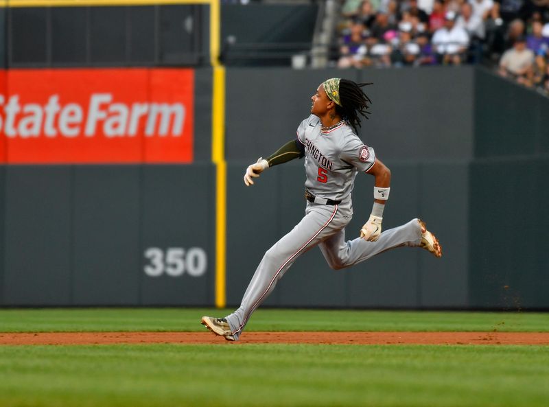 Jun 22, 2024; Denver, Colorado, USA;  Washington Nationals shortstop CJ Abrams (5) runs after hitting a double against the Colorado Rockies in the third inning at Coors Field. Mandatory Credit: John Leyba-USA TODAY Sports