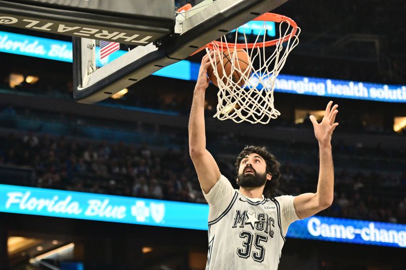 ORLANDO, FLORIDA - NOVEMBER 27: Goga Bitadze #35 of the Orlando Magic shoots a basket in the first half of a game against the Chicago Bulls at Kia Center on November 27, 2024 in Orlando, Florida. NOTE TO USER: User expressly acknowledges and agrees that, by downloading and or using this photograph, User is consenting to the terms and conditions of the Getty Images License Agreement. (Photo by Julio Aguilar/Getty Images)