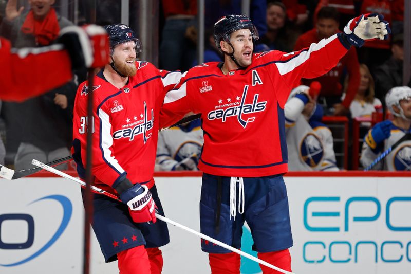 Nov 22, 2023; Washington, District of Columbia, USA; Washington Capitals right wing Tom Wilson (43) celebrates with Washington Capitals right wing Anthony Mantha (39) after scoring the game-tying goal against the Buffalo Sabres in the final minutes of the third period at Capital One Arena. Mandatory Credit: Geoff Burke-USA TODAY Sports