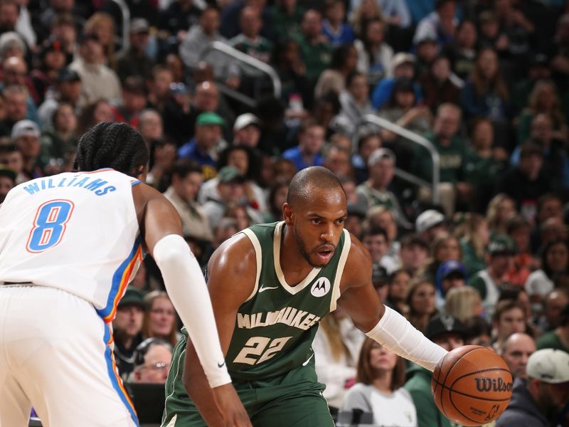 MILWAUKEE, WI - MARCH 24: Khris Middleton #22 of the Milwaukee Bucks handles the ball during the game against the Oklahoma City Thunder on March 24, 2024 at the Fiserv Forum Center in Milwaukee, Wisconsin. NOTE TO USER: User expressly acknowledges and agrees that, by downloading and or using this Photograph, user is consenting to the terms and conditions of the Getty Images License Agreement. Mandatory Copyright Notice: Copyright 2024 NBAE (Photo by Gary Dineen/NBAE via Getty Images).