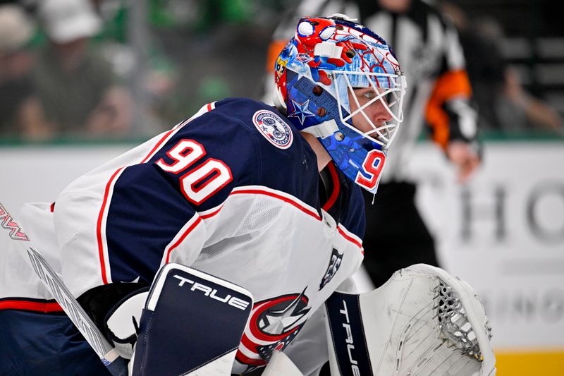 Oct 21, 2025; Dallas, Texas, USA; Columbus Blue Jackets goaltender Elvis Merzlikins (90) faces the Dallas Stars attack during the second period at the American Airlines Center. Mandatory Credit: Jerome Miron-Imagn Images