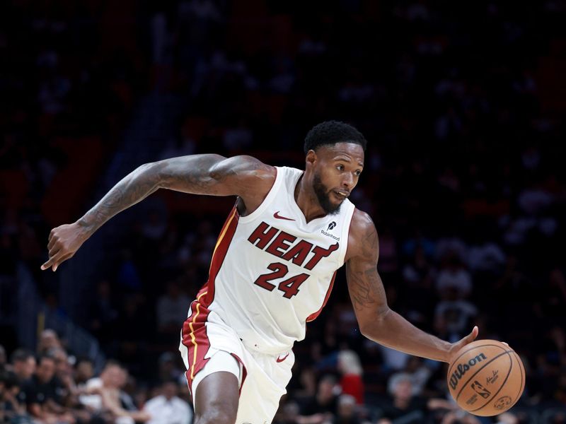 MIAMI, FLORIDA - OCTOBER 23: Haywood Highsmith #24 of the Miami Heat controls the ball against the Orlando Magic during the second half at Kaseya Center on October 23, 2024 in Miami, Florida. NOTE TO USER: User expressly acknowledges and agrees that, by downloading and or using this photograph, User is consenting to the terms and conditions of the Getty Images License Agreement. (Photo by Carmen Mandato/Getty Images)