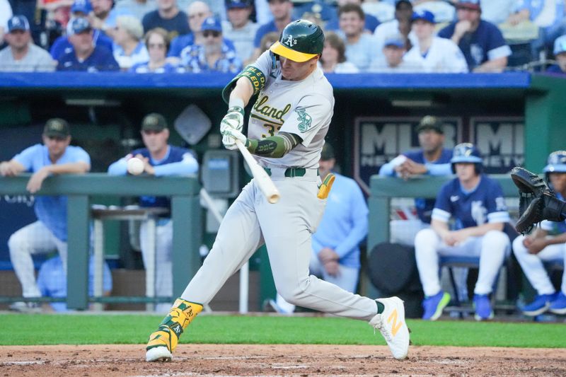 May 17, 2024; Kansas City, Missouri, USA; Oakland Athletics center fielder JJ Bleday (33) hits a double against the Kansas City Royals in the fifth inning at Kauffman Stadium. Mandatory Credit: Denny Medley-USA TODAY Sports