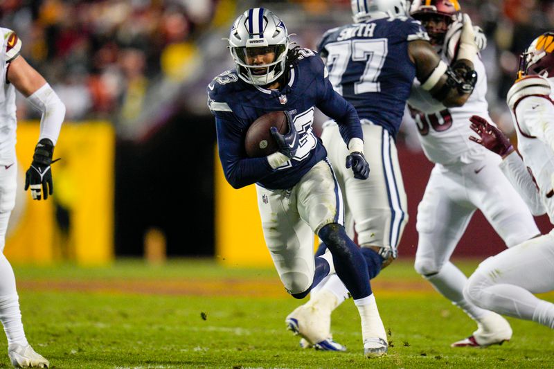 Dallas Cowboys running back Rico Dowdle (23) runs with the ball against the Washington Commanders during the second half, Sunday, January 7, 2024, in Landover, Md. Dallas won 38-10. (AP Photo/Jess Rapfogel)