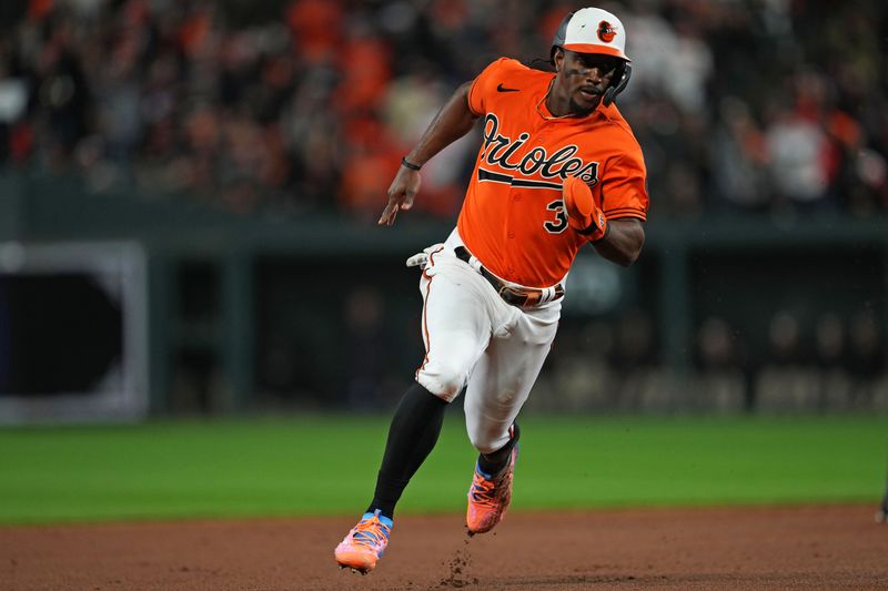 Oct 8, 2023; Baltimore, Maryland, USA; Baltimore Orioles shortstop Jorge Mateo (3) runs to third base during the eighth inning against the Texas Rangers during game two of the ALDS for the 2023 MLB playoffs at Oriole Park at Camden Yards. Mandatory Credit: Mitch Stringer-USA TODAY Sports