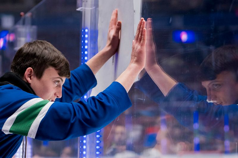 Jan 18, 2024; Vancouver, British Columbia, CAN; Fans watch the Vancouver Canucks warm up prior to a game against the Arizona Coyotes at Rogers Arena.  Mandatory Credit: Bob Frid-USA TODAY Sports