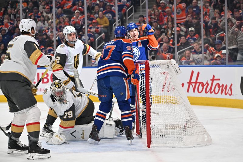 Dec 21, 2025; Edmonton, Alberta, CAN; Edmonton Oilers center Connor McDavid (97) with Oilers center Leon Draisaitl (29) and OIlers center Ryan Ngent-Hopkins (93) celebrate a goal on Vegas Golden Knights goalie Carter Hart (79) as Golden Knights defenseman Zach Whitecloud (2) looks on during the first period at Rogers Place. Mandatory Credit: Walter Tychnowicz-Imagn Images