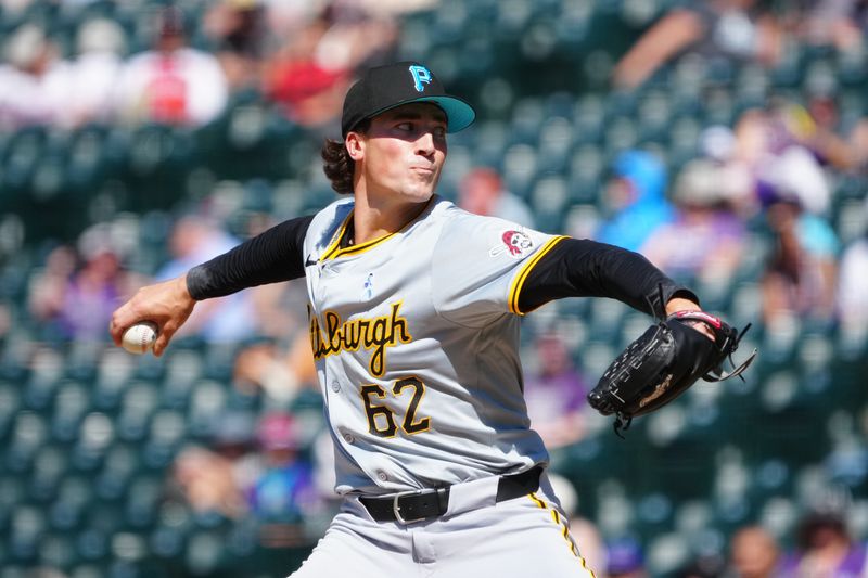 Jun 16, 2024; Denver, Colorado, USA; Pittsburgh Pirates relief pitcher Kyle Nicolas (62) delivers a pitch in the ninth inning against the Colorado Rockies at Coors Field. Mandatory Credit: Ron Chenoy-USA TODAY Sports