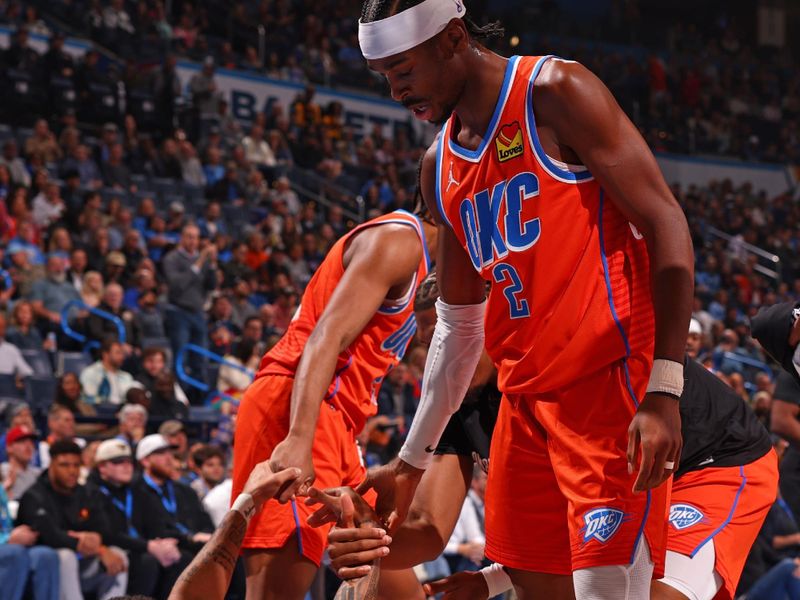 OKLAHOMA CITY, OK - DECEMBER 3: Shai Gilgeous-Alexander #2 of the Oklahoma City Thunder helps teammate off the floor during the game against the Utah Jazz during the Emirates NBA Cup game on on December 3, 2024 at Paycom Center in Oklahoma City, Oklahoma. NOTE TO USER: User expressly acknowledges and agrees that, by downloading and or using this photograph, User is consenting to the terms and conditions of the Getty Images License Agreement. Mandatory Copyright Notice: Copyright 2024 NBAE (Photo by Zach Beeker/NBAE via Getty Images)