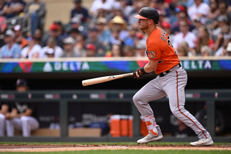 Jul 8, 2023; Minneapolis, Minnesota, USA;  Baltimore Orioles infielder Ryan O'Hearn (32) hits a single against the Minnesota Twins during the second inning at Target Field. Mandatory Credit: Nick Wosika-USA TODAY Sports