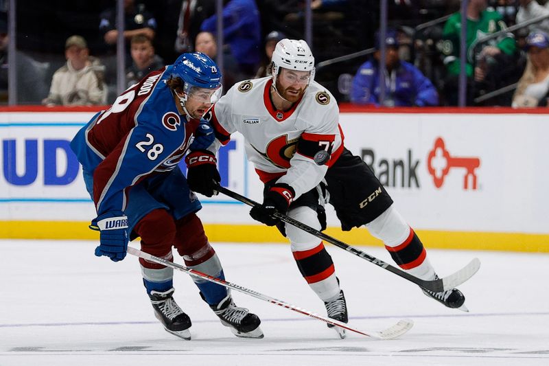 Oct 27, 2024; Denver, Colorado, USA; Colorado Avalanche left wing Miles Wood (28) and Ottawa Senators left wing Brady Tkachuk (7) battle for the puck in the third period at Ball Arena. Mandatory Credit: Isaiah J. Downing-Imagn Images