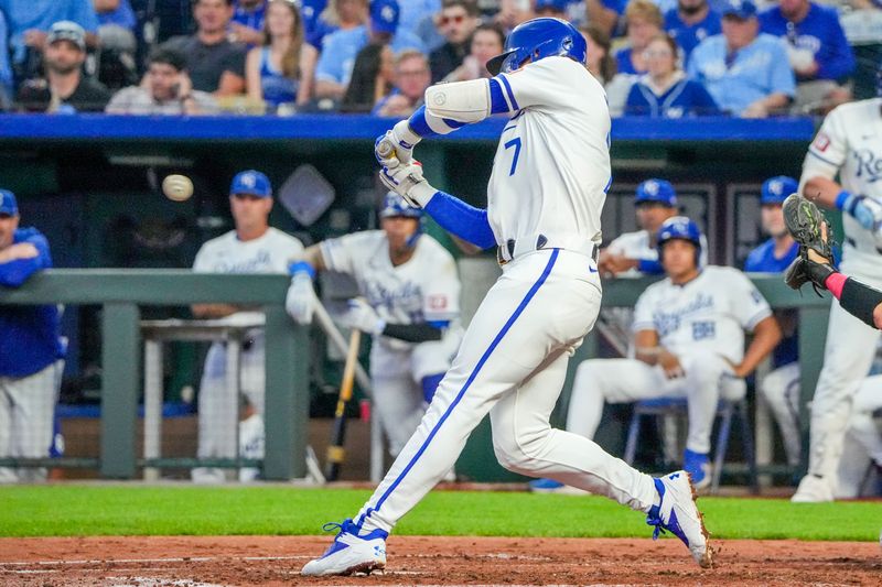 Aug 20, 2024; Kansas City, Missouri, USA; Kansas City Royals shortstop Bobby Witt Jr. (7) hits a single against the Los Angeles Angels in the fourth inning at Kauffman Stadium. Mandatory Credit: Denny Medley-USA TODAY Sports