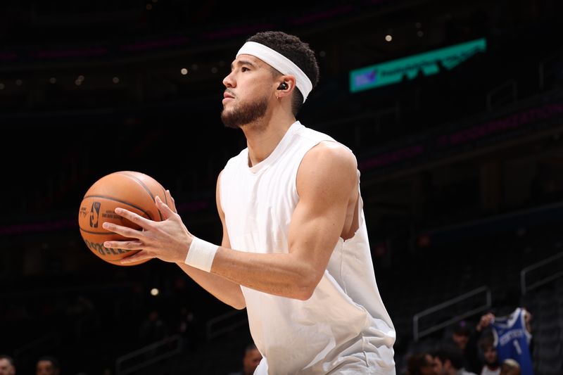 WASHINGTON, DC -?JANUARY 16 : Devin Booker #1 of the Phoenix Suns warms up before the game against the Washington Wizards on January 16, 2025 at Capital One Arena in Washington, DC. NOTE TO USER: User expressly acknowledges and agrees that, by downloading and or using this Photograph, user is consenting to the terms and conditions of the Getty Images License Agreement. Mandatory Copyright Notice: Copyright 2024 NBAE (Photo by Stephen Gosling/NBAE via Getty Images)