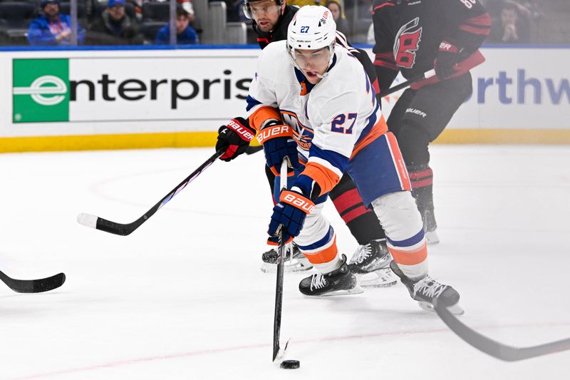 Mar 19, 2024; Elmont, New York, USA; New York Islanders left wing Anders Lee (27) controls the puck against the Carolina Hurricanes during the second period at UBS Arena. Mandatory Credit: Dennis Schneidler-USA TODAY Sports