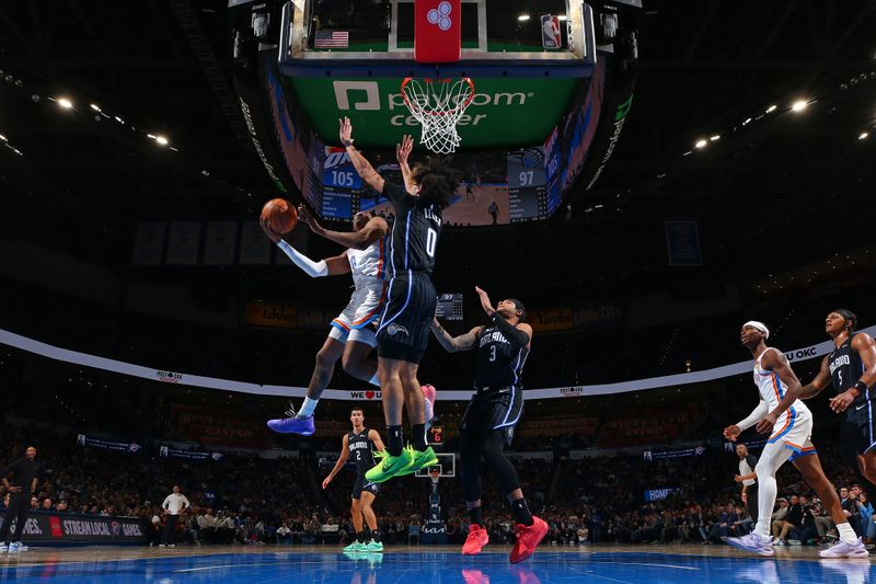 OKLAHOMA CITY, OK - JANUARY 13: Jalen Williams #8 of the Oklahoma City Thunder drives to the basket during the game against the Orlando Magic on January 13, 2024 at Paycom Arena in Oklahoma City, Oklahoma. NOTE TO USER: User expressly acknowledges and agrees that, by downloading and or using this photograph, User is consenting to the terms and conditions of the Getty Images License Agreement. Mandatory Copyright Notice: Copyright 2024 NBAE (Photo by Zach Beeker/NBAE via Getty Images)