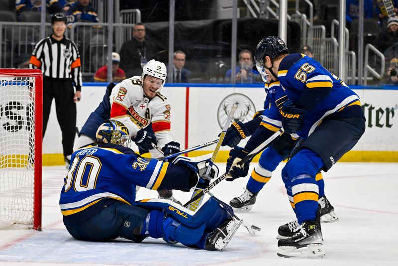 Jan 9, 2024; St. Louis, Missouri, USA;  St. Louis Blues goaltender Joel Hofer (30) and defenseman Colton Parayko (55) defend the net against Florida Panthers left wing Matthew Tkachuk (19) during the third period at Enterprise Center. Mandatory Credit: Jeff Curry-USA TODAY Sports