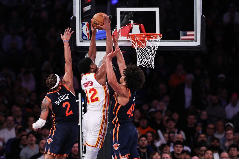 NEW YORK, NEW YORK - MARCH 05: De'Andre Hunter #12 of the Atlanta Hawks dunks the ball during the fourth quarter of the game against the New York Knicks at Madison Square Garden on March 05, 2024 in New York City. NOTE TO USER: User expressly acknowledges and agrees that, by downloading and or using this photograph, User is consenting to the terms and conditions of the Getty Images License Agreement. (Photo by Dustin Satloff/Getty Images)