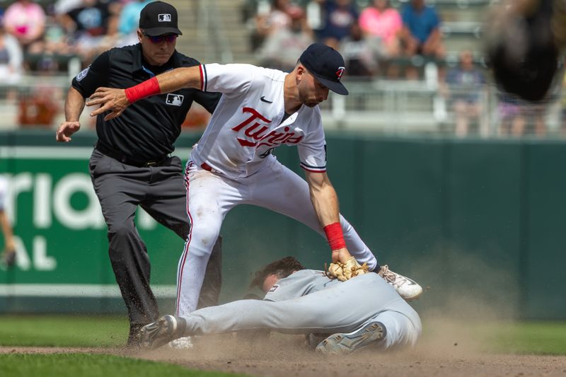 Aug 16, 2023; Minneapolis, Minnesota, USA; Minnesota Twins second baseman Edouard Julien (47) tags out Detroit Tigers third baseman Matt Vierling (8) trying to steal second base in the ninth inning at Target Field. Mandatory Credit: Jesse Johnson-USA TODAY Sports