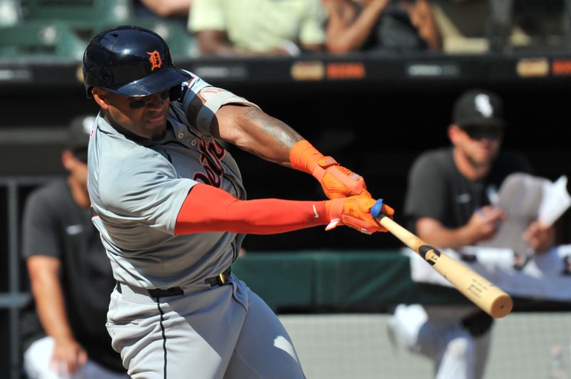 Aug 25, 2024; Chicago, Illinois, USA; Detroit Tigers second base Andy Ibanez (77) hits a two-run home run during the seventh inning against the Chicago White Sox at Guaranteed Rate Field. Mandatory Credit: Patrick Gorski-USA TODAY Sports