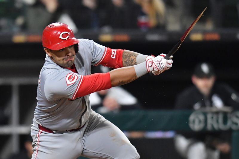 Apr 12, 2024; Chicago, Illinois, USA; Cincinnati Reds first base Christian Encarnacion-Strand (33) hits a two-run single while breaking his bat during the eighth inning against the Chicago White Sox at Guaranteed Rate Field. Mandatory Credit: Patrick Gorski-USA TODAY Sports