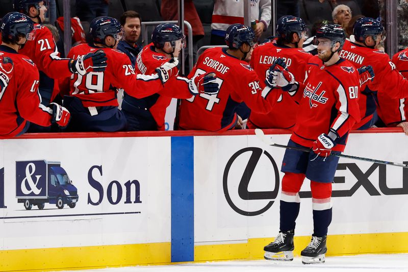 Oct 4, 2025; Washington, District of Columbia, USA; Washington Capitals left wing Pierre-Luc Dubois (80) celebrates with teammates after scoring a goal against the Columbus Blue Jackets in the second period at Capital One Arena. Mandatory Credit: Geoff Burke-Imagn Images