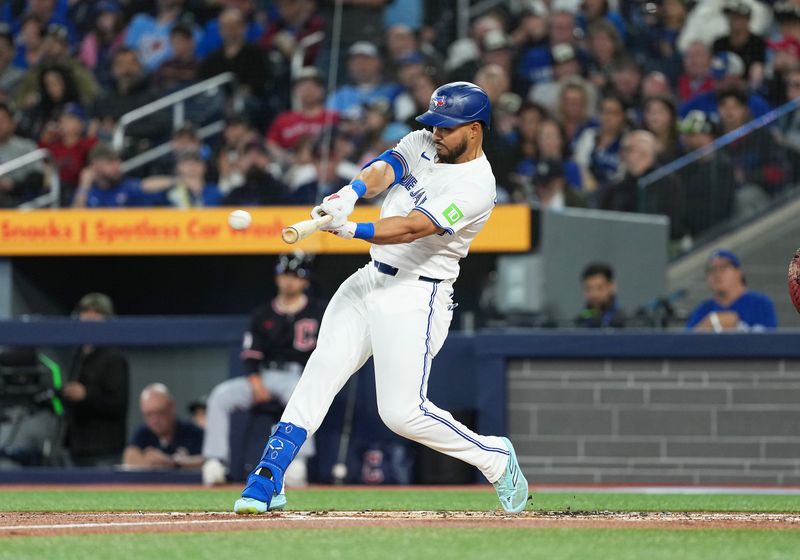 May 3, 2025; Toronto, Ontario, CAN; Toronto Blue Jays designated hitter Anthony Santander (25) hits a single against the Cleveland Guardians during the first inning at Rogers Centre. Mandatory Credit: Nick Turchiaro-Imagn Images