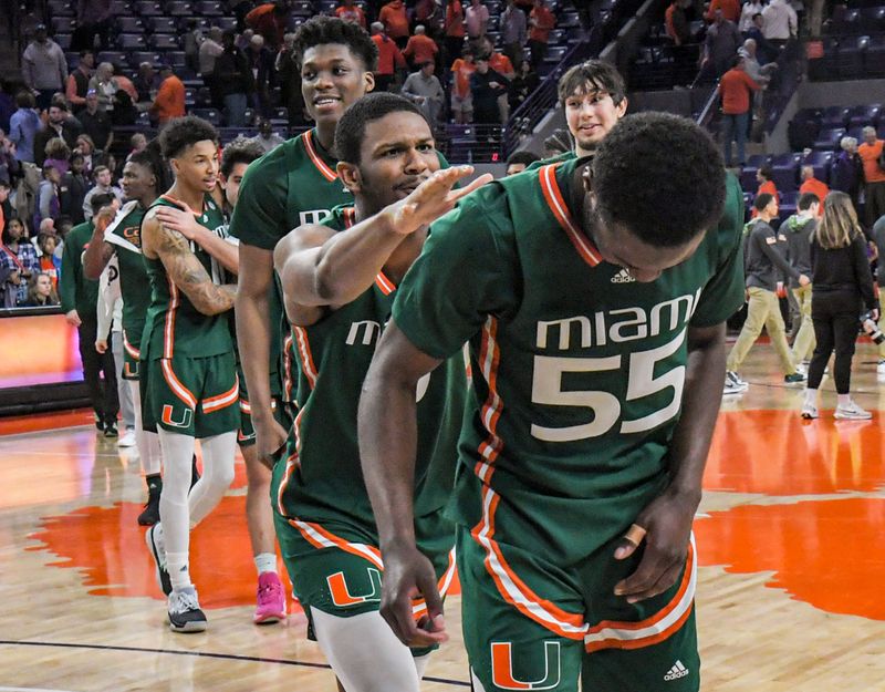 Feb 4, 2023; Clemson, South Carolina, USA; Miami forward AJ Casey (0) and Miami guard Wooga Poplar (55) celebrate with teammates after the game at Littlejohn Coliseum in Clemson, S.C. Saturday, Feb. 4, 2023. Miami won 78-74.   Mandatory Credit: Ken Ruinard-USA TODAY Sports