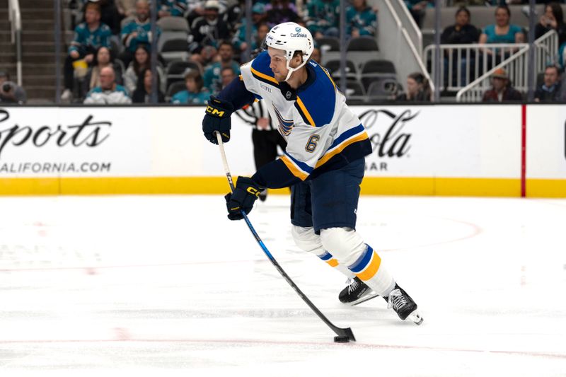 Oct 10, 2024; San Jose, California, USA; St. Louis Blues defenseman Philip Broberg (6) controls the puck during the first period against the San Jose Sharks at SAP Center at San Jose. Mandatory Credit: Stan Szeto-Imagn Images