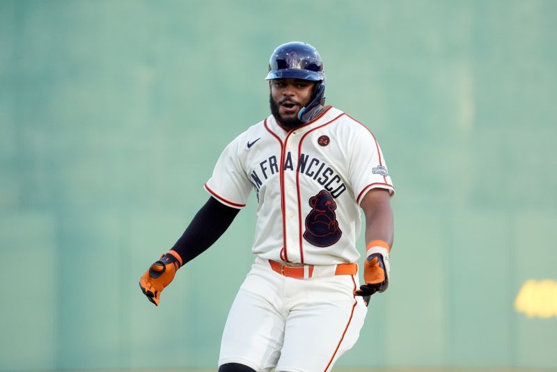 Jun 20, 2024; Fairfield, Alabama, USA; San Francisco Giants outfielder Heliot Ramos (17) rounds the bases after hitting a home run during the 3rd inning against the St. Louis Cardinals in the MLB at Rickwood Field tribute game to the Negro Leagues. Rickwood Field is the oldest baseball stadium in America. Mandatory Credit: John David Mercer-USA TODAY Sports