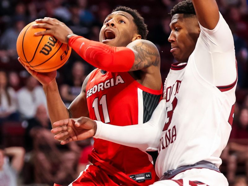 Mar 4, 2023; Columbia, South Carolina, USA; Georgia Bulldogs guard Justin Hill (11) attempts to shoot over South Carolina Gamecocks forward Gregory \