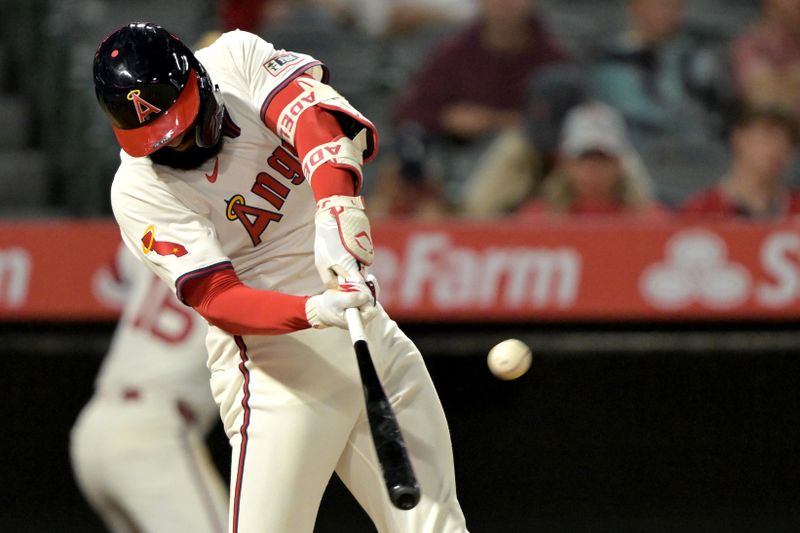 Jul 30, 2024; Anaheim, California, USA; Los Angeles Angels right fielder Jo Adell (7) hits a solo home run in the seventh inning against the Colorado Rockies at Angel Stadium. Mandatory Credit: Jayne Kamin-Oncea-USA TODAY Sports