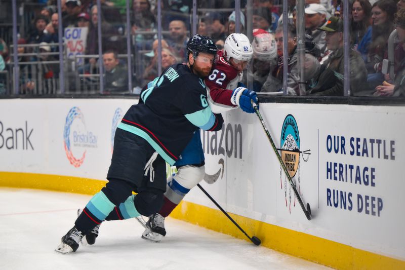 Dec 16, 2025; Seattle, Washington, USA; Seattle Kraken defenseman Adam Larsson (6) pushes Colorado Avalanche left wing Artturi Lehkonen (62) against the wall during the first period at Climate Pledge Arena. Mandatory Credit: Steven Bisig-Imagn Images