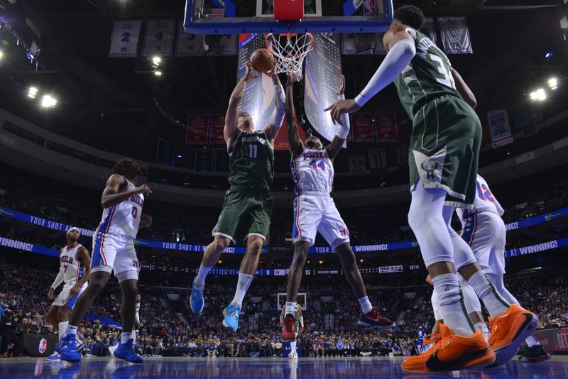 PHILADELPHIA, PA - FEBRUARY 25: Brook Lopez #11 of the Milwaukee Bucks grabs a rebound during the game against the Philadelphia 76ers on February 25, 2024 at the Wells Fargo Center in Philadelphia, Pennsylvania NOTE TO USER: User expressly acknowledges and agrees that, by downloading and/or using this Photograph, user is consenting to the terms and conditions of the Getty Images License Agreement. Mandatory Copyright Notice: Copyright 2024 NBAE (Photo by Jesse D. Garrabrant/NBAE via Getty Images)