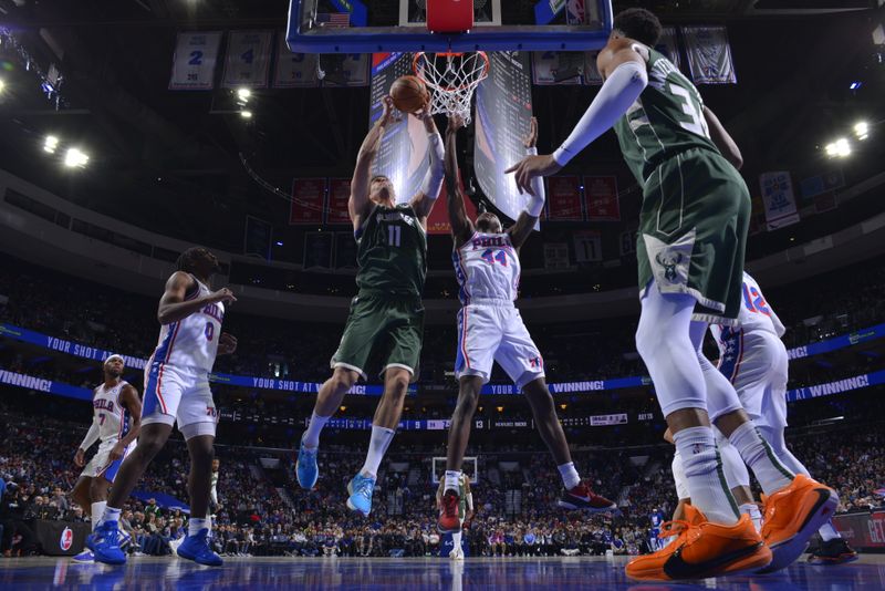 PHILADELPHIA, PA - FEBRUARY 25: Brook Lopez #11 of the Milwaukee Bucks grabs a rebound during the game against the Philadelphia 76ers on February 25, 2024 at the Wells Fargo Center in Philadelphia, Pennsylvania NOTE TO USER: User expressly acknowledges and agrees that, by downloading and/or using this Photograph, user is consenting to the terms and conditions of the Getty Images License Agreement. Mandatory Copyright Notice: Copyright 2024 NBAE (Photo by Jesse D. Garrabrant/NBAE via Getty Images)