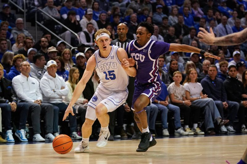 Jan 14, 2026; Provo, Utah, USA; BYU Cougars guard Richie Saunders (15) controls the ball against the TCU Horned Frogs during the first half  at Marriott Center. Mandatory Credit: Aaron Baker-Imagn Images