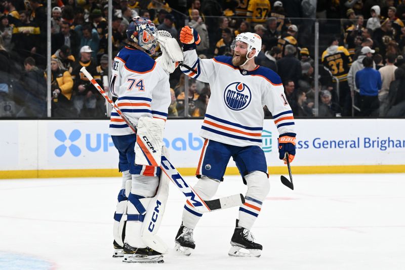 Mar 9, 2023; Boston, Massachusetts, USA; Edmonton Oilers defenseman Mattias Ekholm (14) celebrates with goaltender Stuart Skinner (74) after defeating the Boston Bruins at the TD Garden. Mandatory Credit: Brian Fluharty-USA TODAY Sports