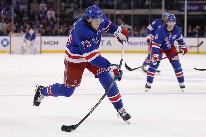 Feb 28, 2024; New York, New York, USA; New York Rangers center Matt Rempe (73) takes a shot against the Columbus Blue Jackets during the second period at Madison Square Garden. Mandatory Credit: Brad Penner-USA TODAY Sports