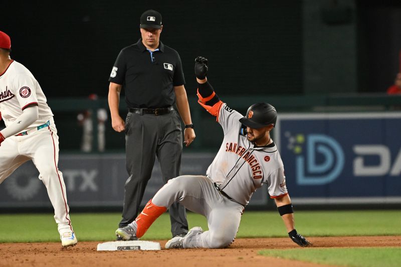 Aug 6, 2024; Washington, District of Columbia, USA; San Francisco Giants left fielder Michael Conforto (8) slides into second base after hitting a double against the Washington Nationals against the Washington Nationals at Nationals Park. Mandatory Credit: Rafael Suanes-USA TODAY Sports