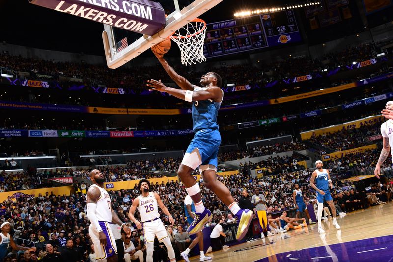 LOS ANGELES, CA - MARCH 10: Anthony Edwards #5 of the Minnesota Timberwolves drives to the basket during the game against the Los Angeles Lakers on March 10, 2024 at Crypto.Com Arena in Los Angeles, California. NOTE TO USER: User expressly acknowledges and agrees that, by downloading and/or using this Photograph, user is consenting to the terms and conditions of the Getty Images License Agreement. Mandatory Copyright Notice: Copyright 2024 NBAE (Photo by Adam Pantozzi/NBAE via Getty Images)