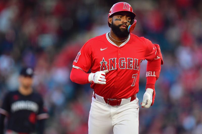 Apr 27, 2024; Anaheim, California, USA; Los Angeles Angels right fielder Jo Adell (7) rounds the bases after hitting a two run home run against the Minnesota Twins during the second inning at Angel Stadium. Mandatory Credit: Gary A. Vasquez-USA TODAY Sports