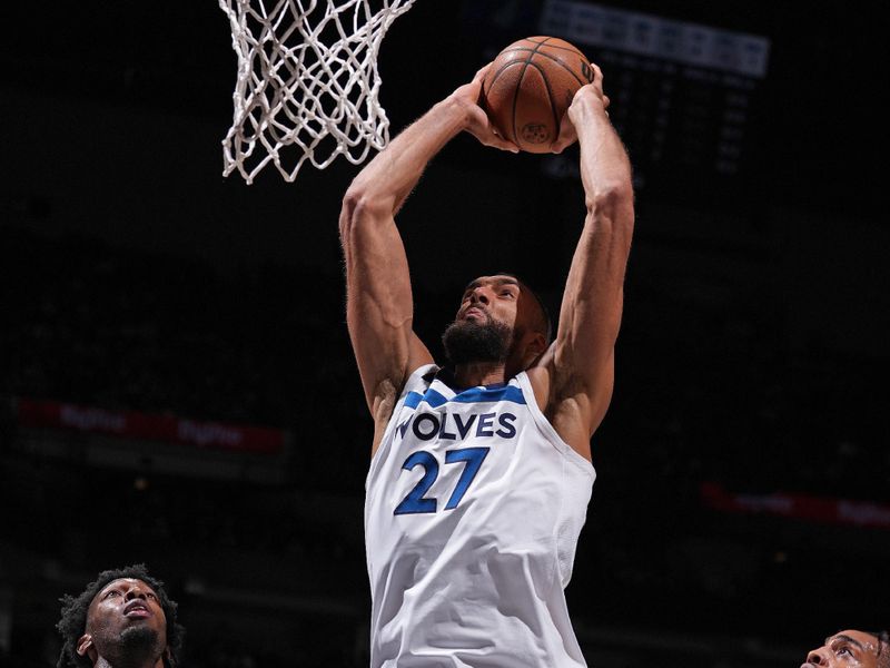 MINNEAPOLIS, MN -  MARCH 27:  Rudy Gobert #27 of the Minnesota Timberwolves dunks the ball during the game against the Detroit Pistons on March 27, 2024 at Target Center in Minneapolis, Minnesota. NOTE TO USER: User expressly acknowledges and agrees that, by downloading and or using this Photograph, user is consenting to the terms and conditions of the Getty Images License Agreement. Mandatory Copyright Notice: Copyright 2024 NBAE (Photo by Jordan Johnson/NBAE via Getty Images)