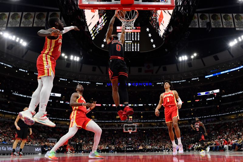 CHICAGO, ILLINOIS - APRIL 04: Coby White #0 of the Chicago Bulls shoots against the Atlanta Hawks at United Center on April 04, 2023 in Chicago, Illinois. NOTE TO USER: User expressly acknowledges and agrees that, by downloading and or using this photograph, User is consenting to the terms and conditions of the Getty Images License Agreement.  (Photo by Quinn Harris/Getty Images)