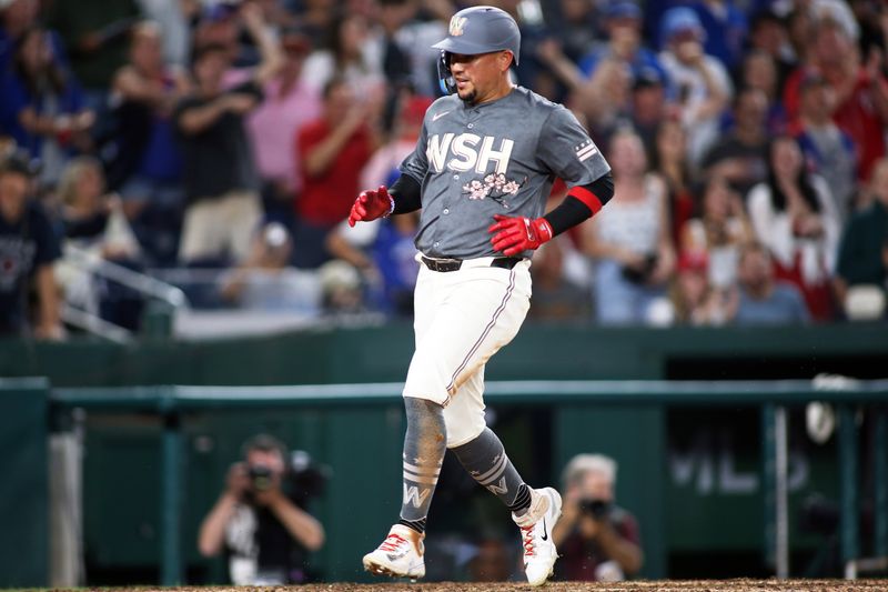 Aug 30, 2024; Washington, District of Columbia, USA; Washington Nationals second baseman Ildemaro Vargas (14) scores a run during the ninth inning against the Chicago Cubs at Nationals Park. Mandatory Credit: Daniel Kucin Jr.-USA TODAY Sports


