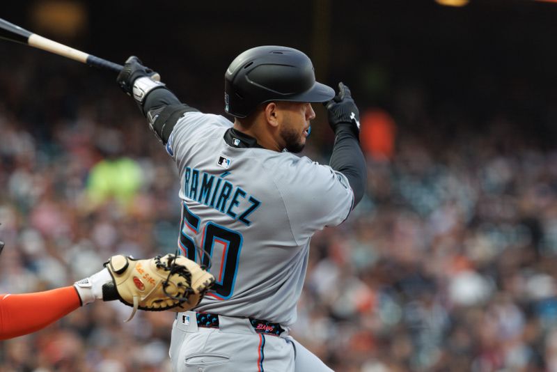Jun 25, 2025; San Francisco, California, USA; Miami Marlins catcher Agustín Ramírez (50) hits a single during the fourth inning against the San Francisco Giants at Oracle Park. Mandatory Credit: Sergio Estrada-Imagn Images