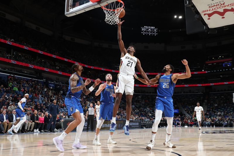 NEW ORLEANS, LA - JANUARY 15:  Yves Missi #21 of the New Orleans Pelicans shoots the ball during the game against the Dallas Mavericks on January 15, 2025 at the Smoothie King Center in New Orleans, Louisiana. NOTE TO USER: User expressly acknowledges and agrees that, by downloading and or using this Photograph, user is consenting to the terms and conditions of the Getty Images License Agreement. Mandatory Copyright Notice: Copyright 2025 NBAE (Photo by Layne Murdoch Jr./NBAE via Getty Images)