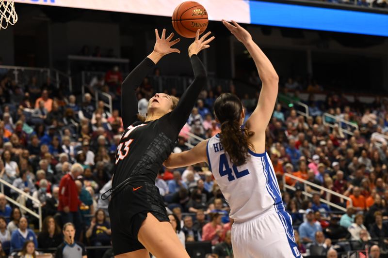 Mar 4, 2023; Greensboro, NC, USA; Virginia Tech Hokies center Elizabeth Kitley (33) battles for an inbounds pass against Duke Blue Devils forward Mia Heide (42) during the first half at Greensboro Coliseum. Mandatory Credit: William Howard-USA TODAY Sports