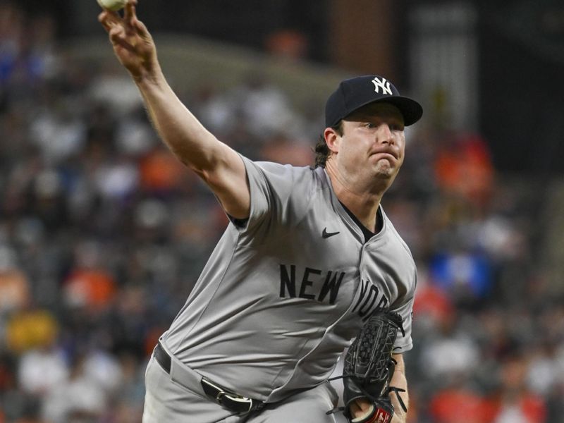 Jul 12, 2024; Baltimore, Maryland, USA; New York Yankees pitcher Gerrit Cole (45) throws a third inning pitch against the Baltimore Orioles  at Oriole Park at Camden Yards. Mandatory Credit: Tommy Gilligan-USA TODAY Sports